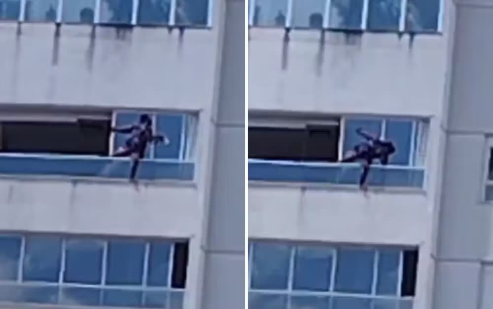 VÍDEO: Mulher se pendura do lado de fora de cobertura para limpar vidraça, em GO
