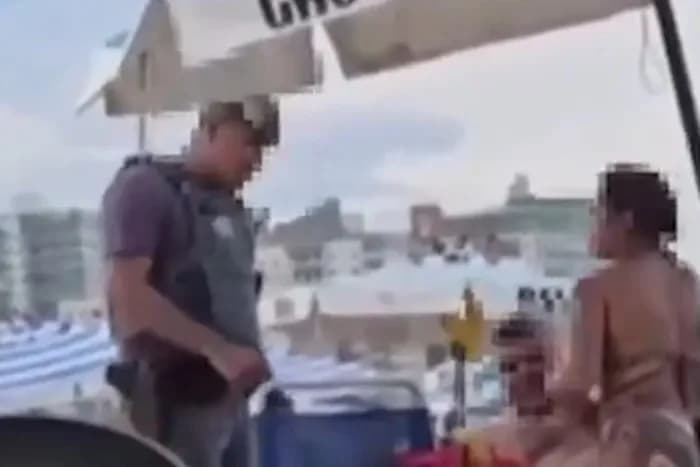 VÍDEO: PM interrompe casal &#8220;se pegando&#8221; em praia de SP